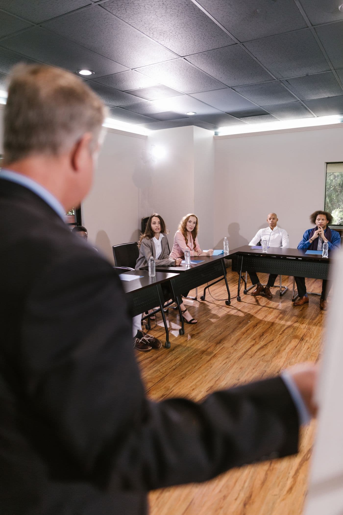 Diverse leadership team discussing workplace strategy in a conference room